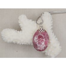 Thulit medál kaboson